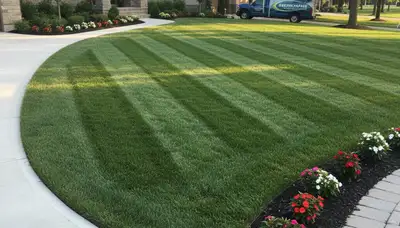 Professional lawn mowing with crisp edging and striped patterns in Bellevue, NE by Chop Chop Landscaping